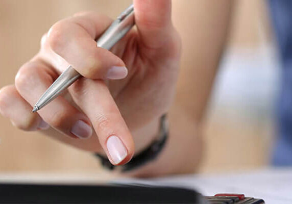 hand and calculator